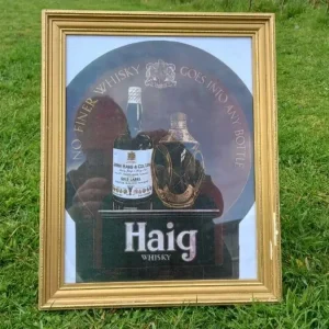 Framed vintage Haig Whisky print featuring crown, bottle artwork, and promotional slogan – ideal for bar or drinks room décor.